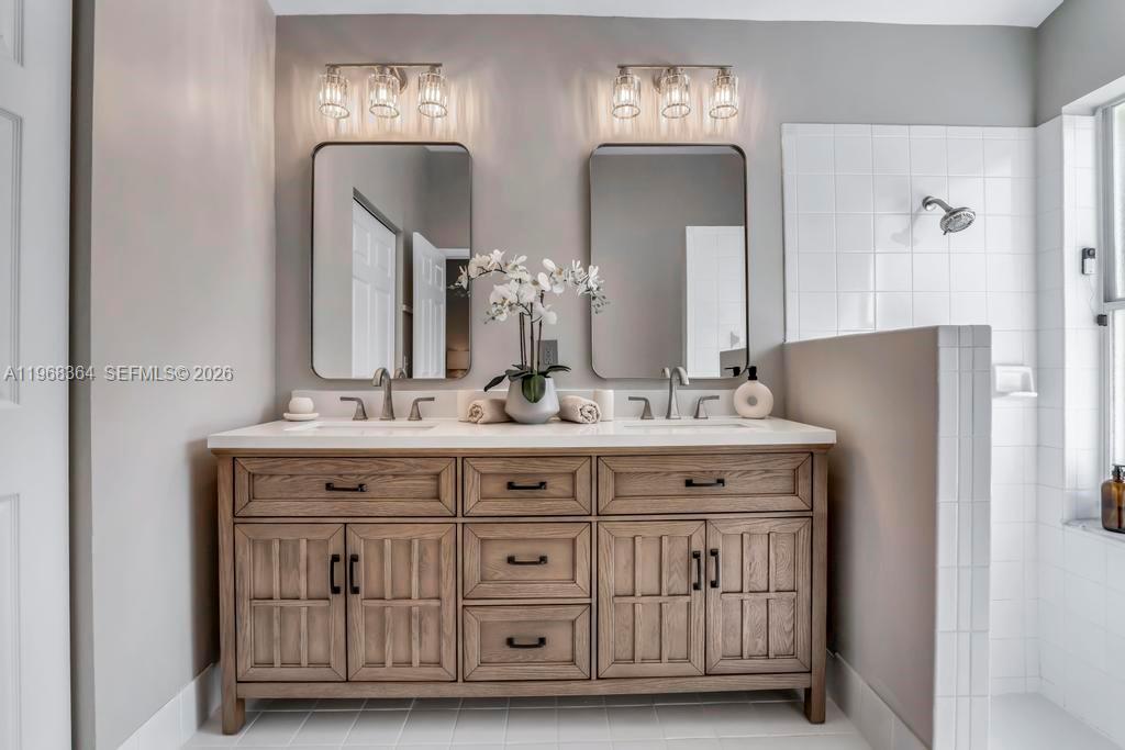 2972 Southwest 174th Avenue Miramar, FL 33029 - Photo 21 of 55 a bathroom with a double vanity sink and a mirror