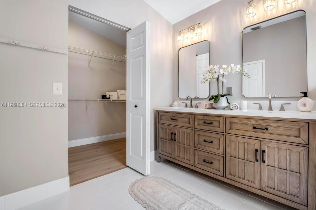 2972 Southwest 174th Avenue Miramar, FL 33029 - Photo 22 of 55 a spacious bathroom with a granite countertop sink a mirror and a shower
