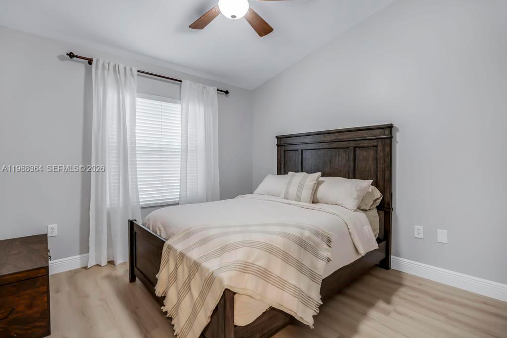 2972 Southwest 174th Avenue Miramar, FL 33029 - Photo 24 of 55 a bedroom with a bed and a large window