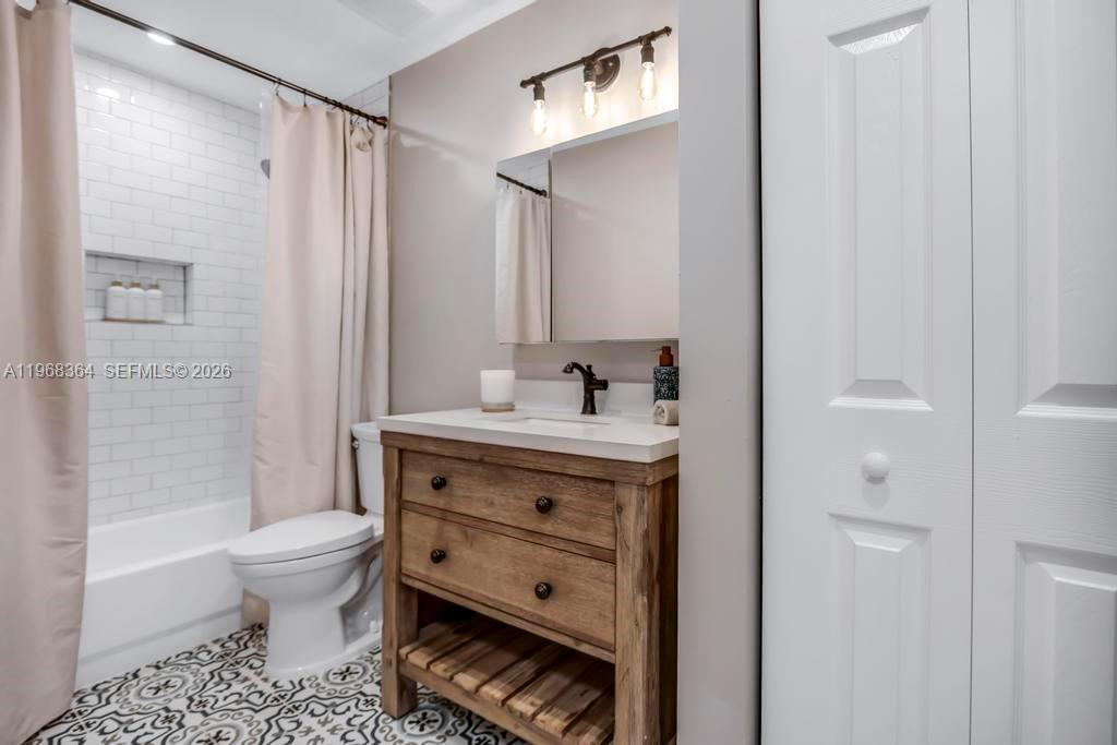 2972 Southwest 174th Avenue Miramar, FL 33029 - Photo 25 of 55 a bathroom with a sink a toilet and shower