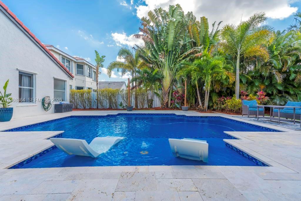 2972 Southwest 174th Avenue Miramar, FL 33029 - Photo 30 of 55 a view of swimming pool with outdoor seating and plants