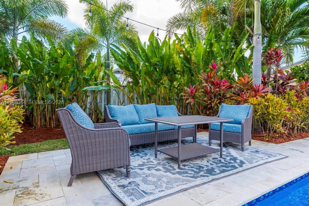 2972 Southwest 174th Avenue Miramar, FL 33029 - Photo 36 of 55 a outdoor living space with furniture and a potted plant