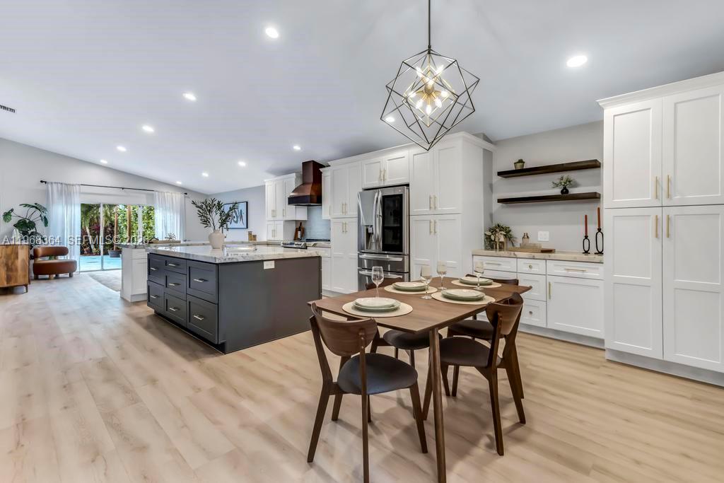 2972 Southwest 174th Avenue Miramar, FL 33029 - Photo 4 of 55 a view of a dining room with furniture and wooden floor