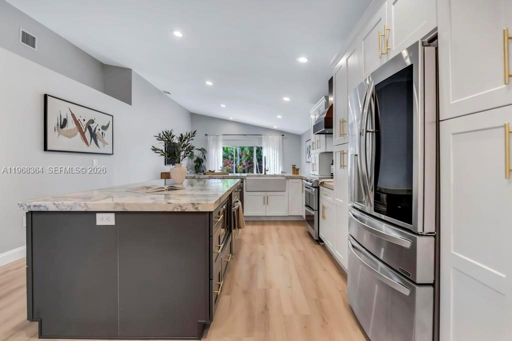 2972 Southwest 174th Avenue Miramar, FL 33029 - Photo 5 of 55 a kitchen with stainless steel appliances a sink stove and refrigerator