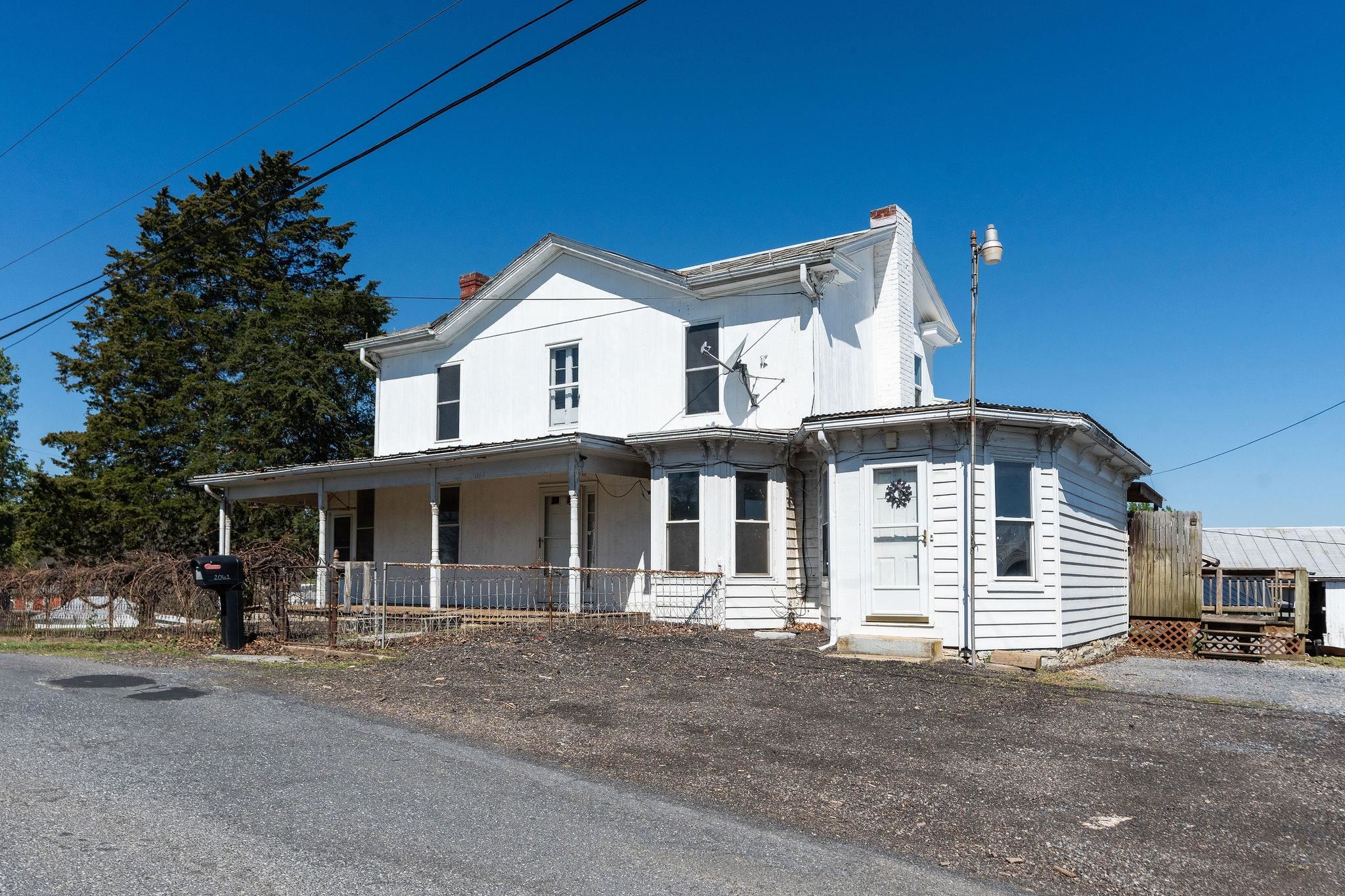 2061 Cecil Wampler Road Mount Crawford, VA 22841 - Photo 7 of 70 a front view of a house with a garden
