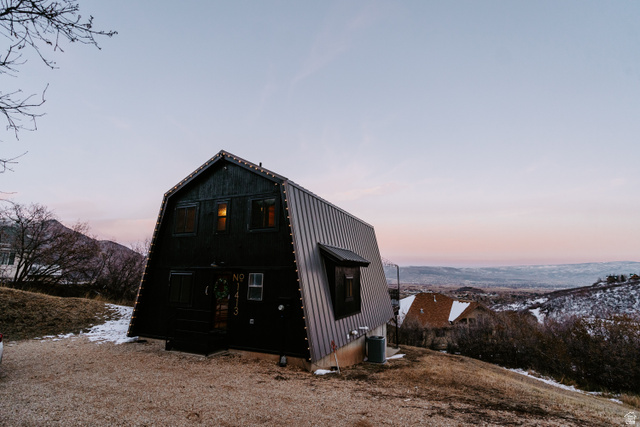 1413 Basel Drive Midway, UT 84049 - Photo 105 of 137 Rear view of house featuring a gambrel roof