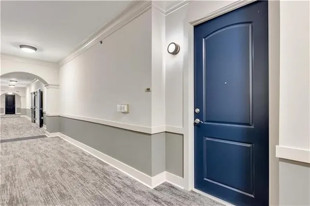 a view of a hallway with front door