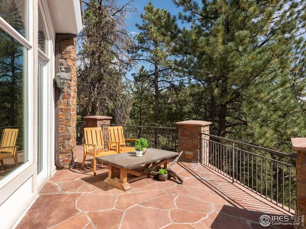 a view of a patio with a table and chairs