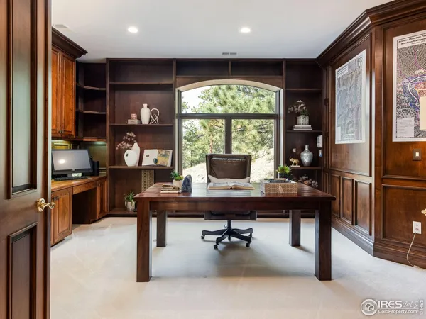 a workspace with furniture and a window