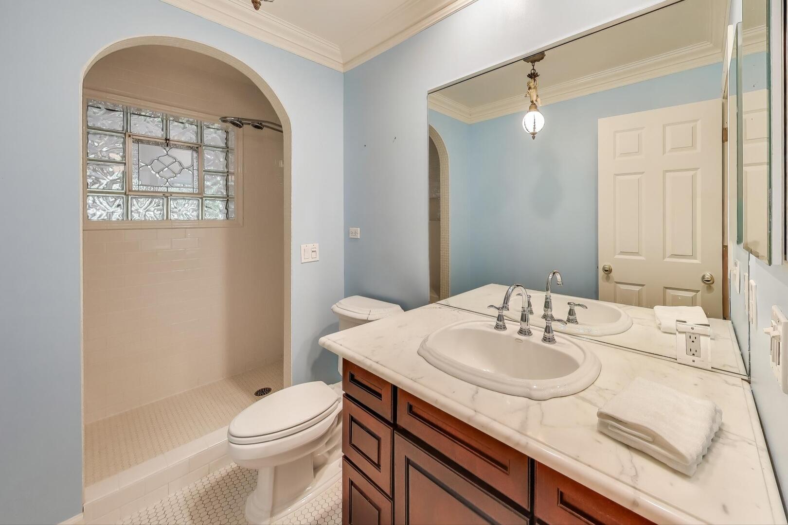 506 Busse Road Mount Prospect, IL 60056 - Photo 25 of 41 a bathroom with a sink toilet and shower