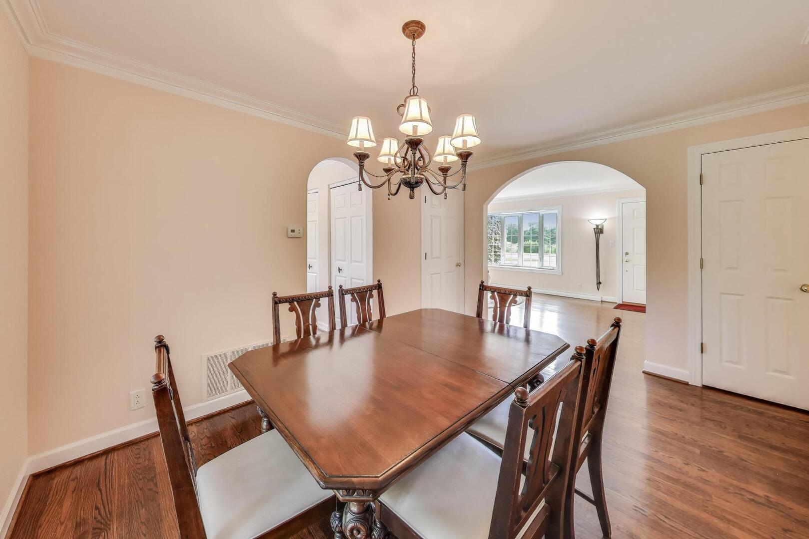 506 Busse Road Mount Prospect, IL 60056 - Photo 8 of 41 a view of a dining room with furniture and wooden floor
