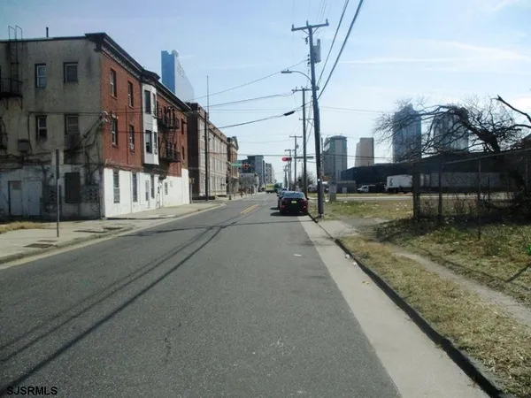 a view of a street with cars