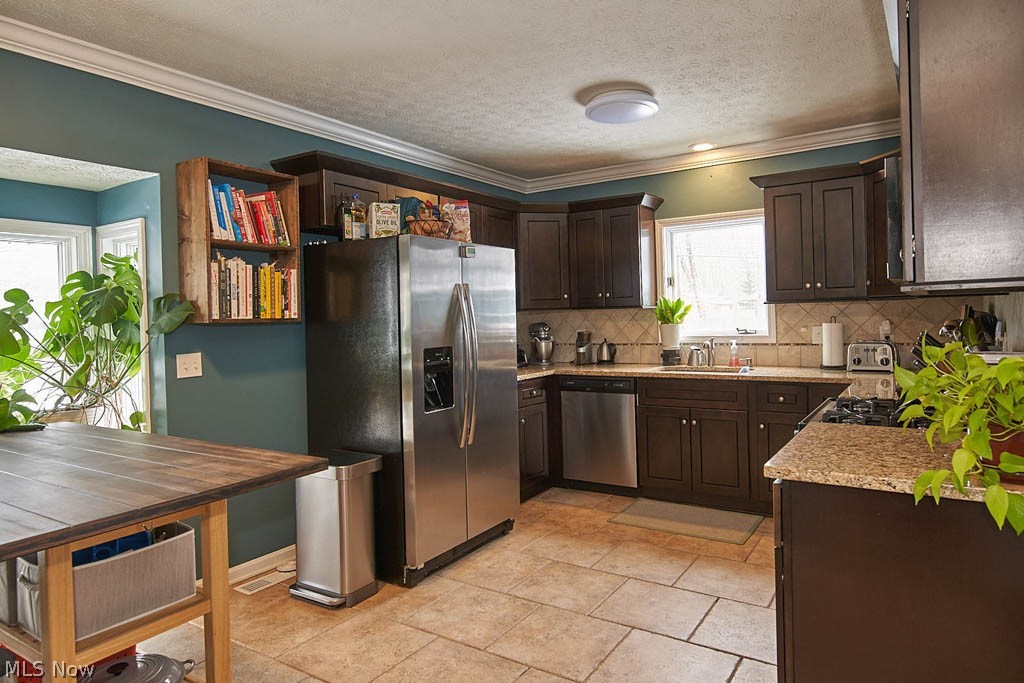 Updated kitchen has stainless steel appliances.