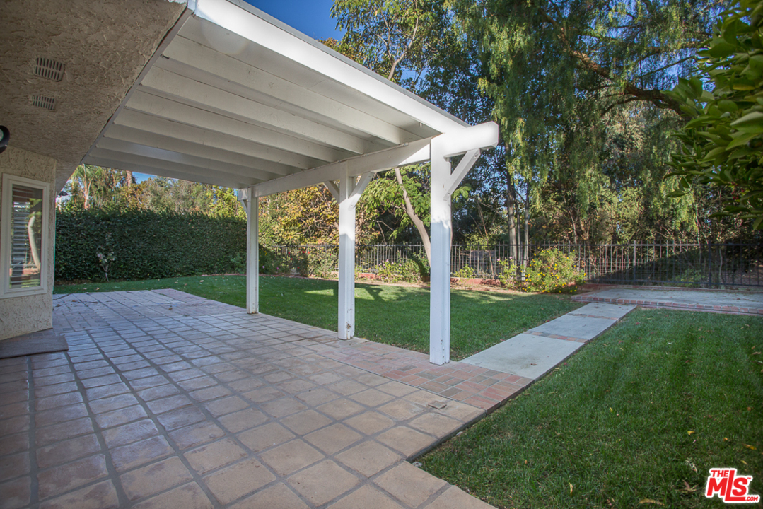 13639 Bear Valley Road Moorpark, CA 93021 - Photo 20 of 25 a view of a yard with porch and a garden