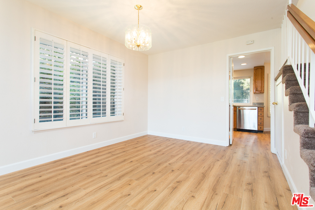 13639 Bear Valley Road Moorpark, CA 93021 - Photo 4 of 25 a view of empty room with wooden floor and fan