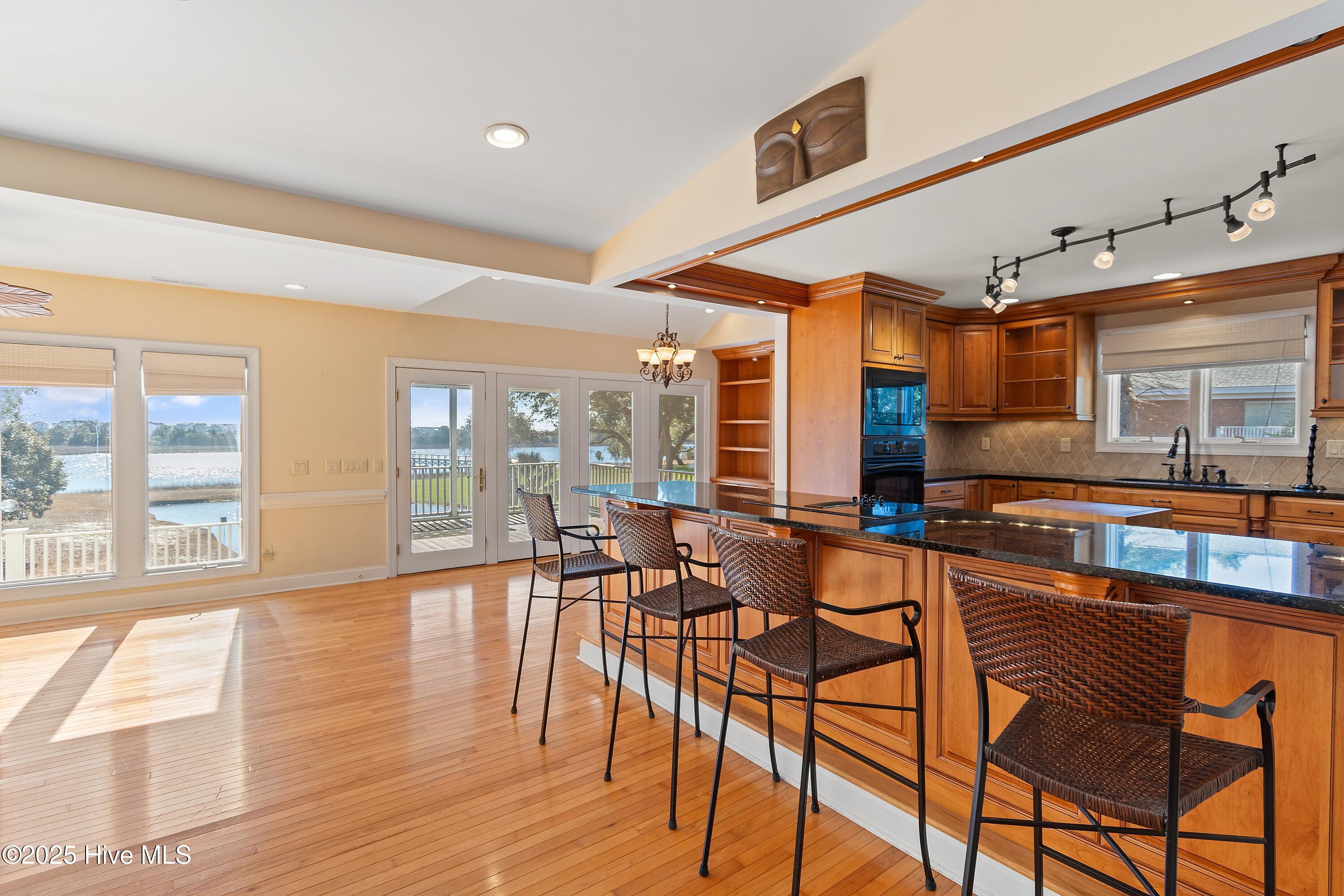 6777 Roberta Road Southwest Ocean Isle Beach, NC 28469 - Photo 18 of 89 Long roomy Handsome Granite bar for large crowds