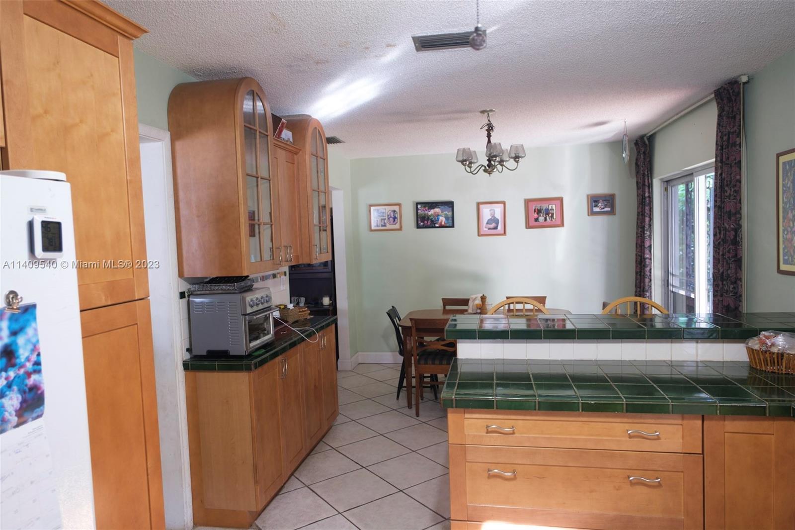 250 Southwest 22nd Road Miami, FL 33129 - Photo 8 of 18 a kitchen with a stove and a refrigerator