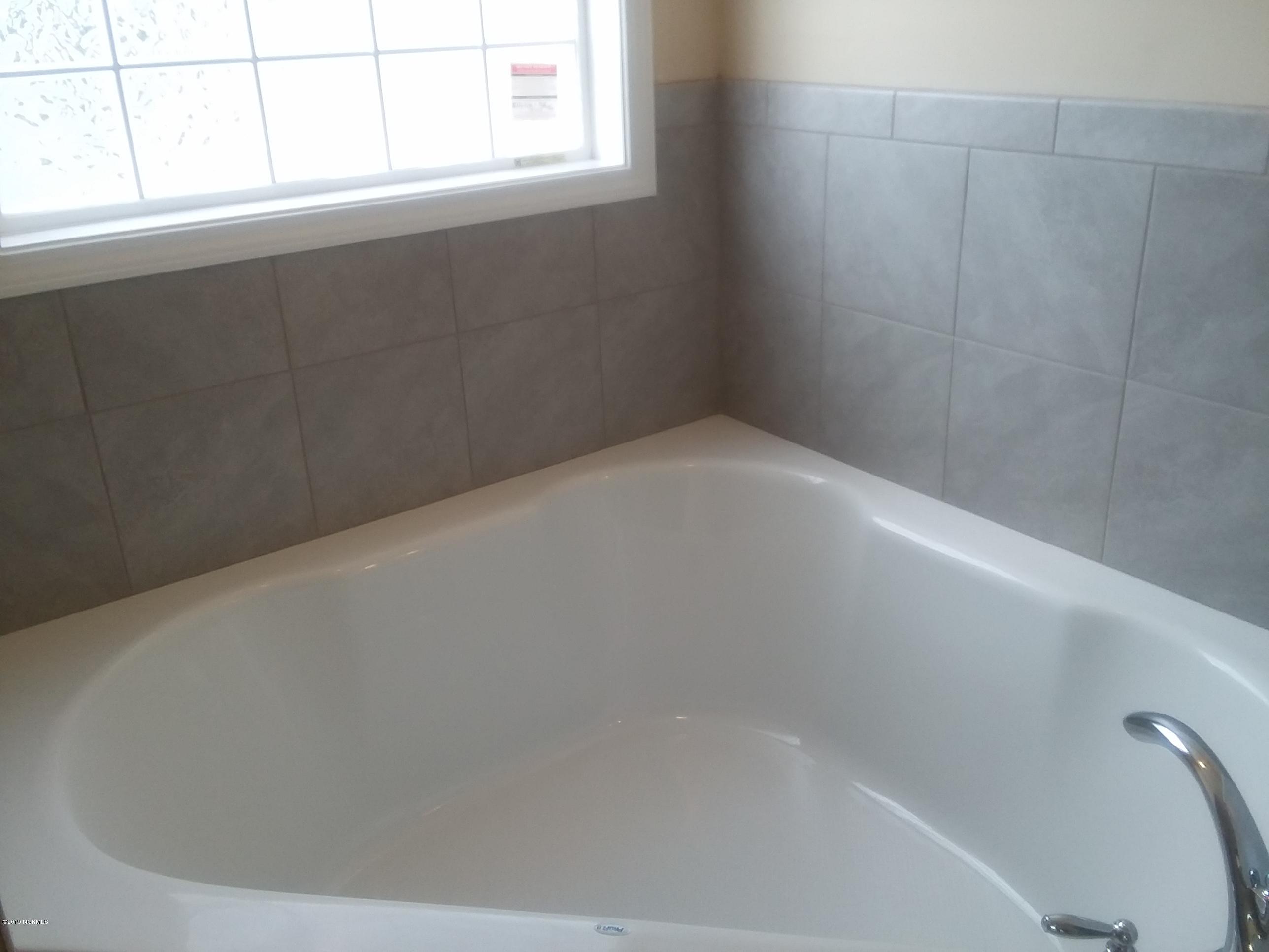 872 Rolling Pines Loop Road Leland, NC 28451 - Photo 12 of 14 Master Bath Tub With Tile surround