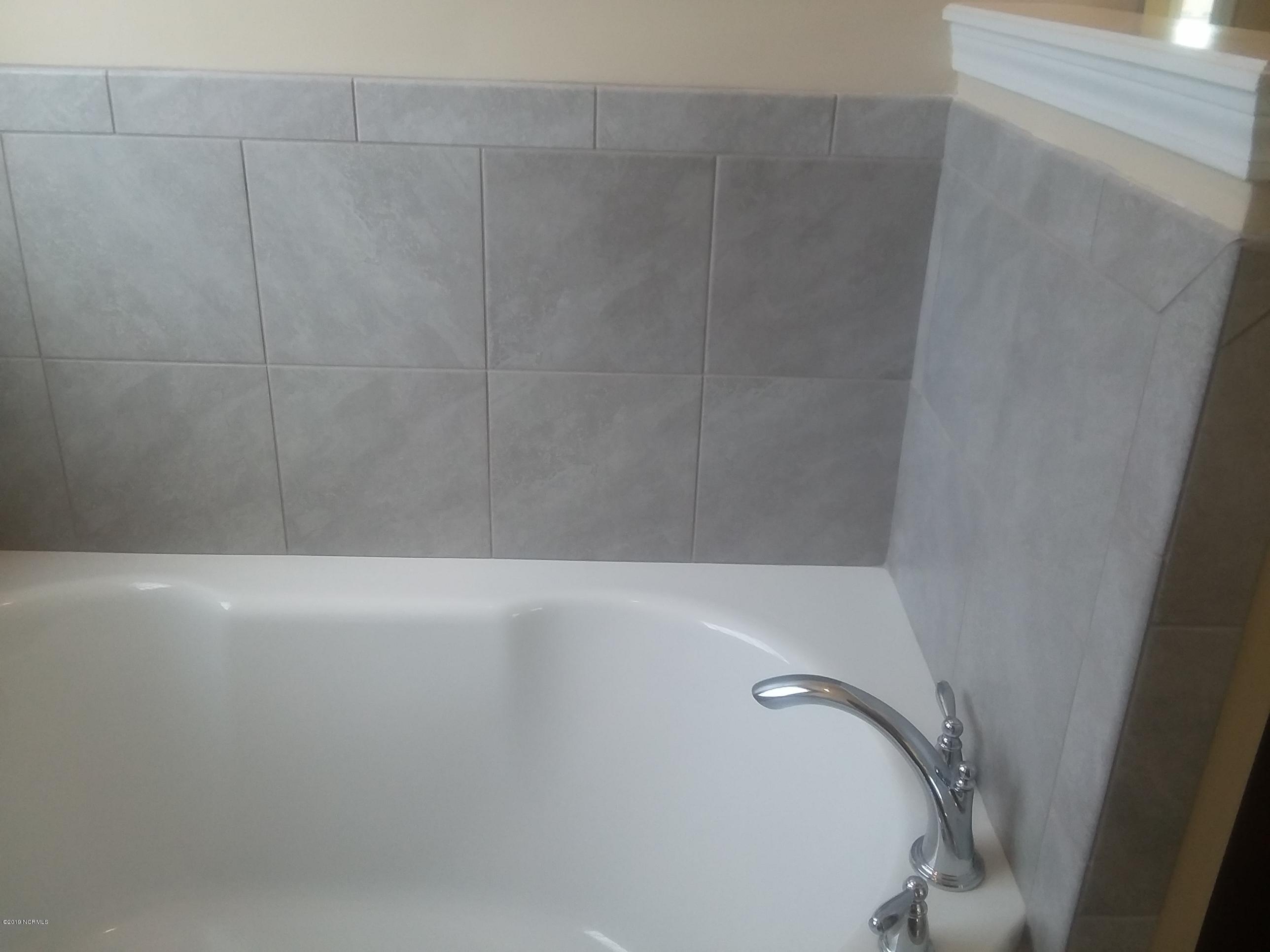 872 Rolling Pines Loop Road Leland, NC 28451 - Photo 13 of 14 Master Bath Tub With Tile surround