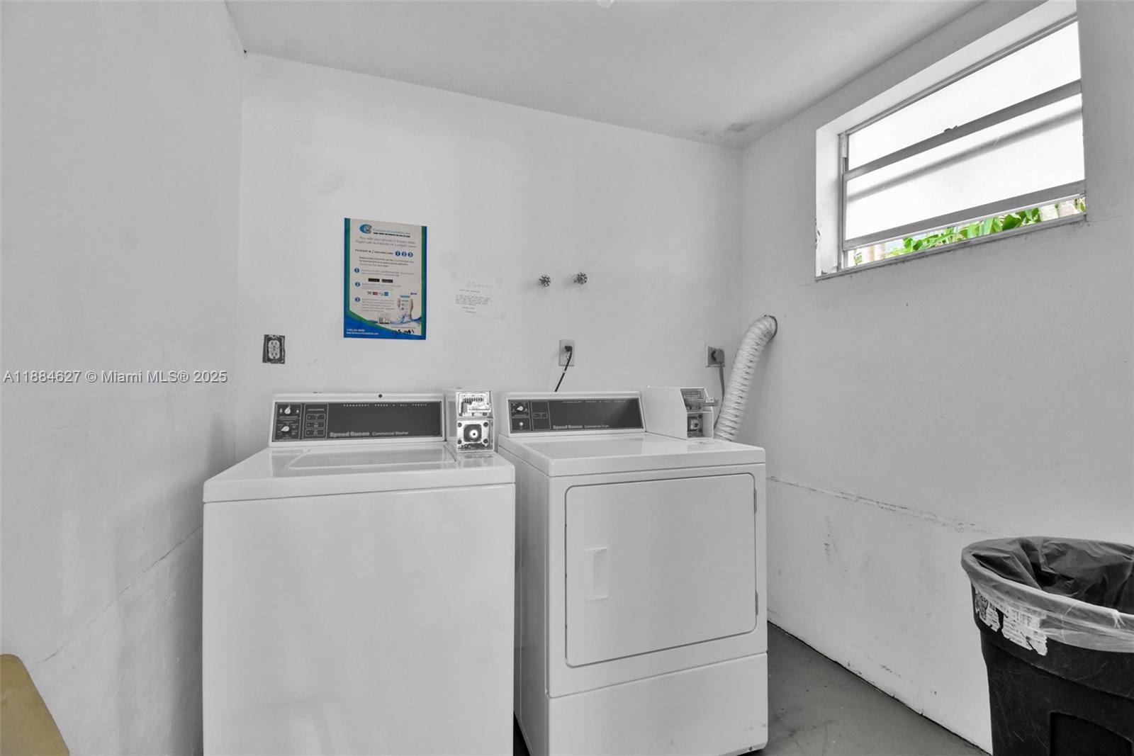618 Euclid Avenue, Unit 303 Miami Beach, FL 33139 - Photo 15 of 26 a view of washer and dryer with kitchen in the background