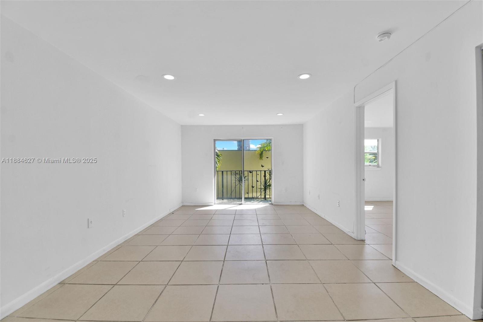 618 Euclid Avenue, Unit 303 Miami Beach, FL 33139 - Photo 2 of 26 a view of an empty room with a window