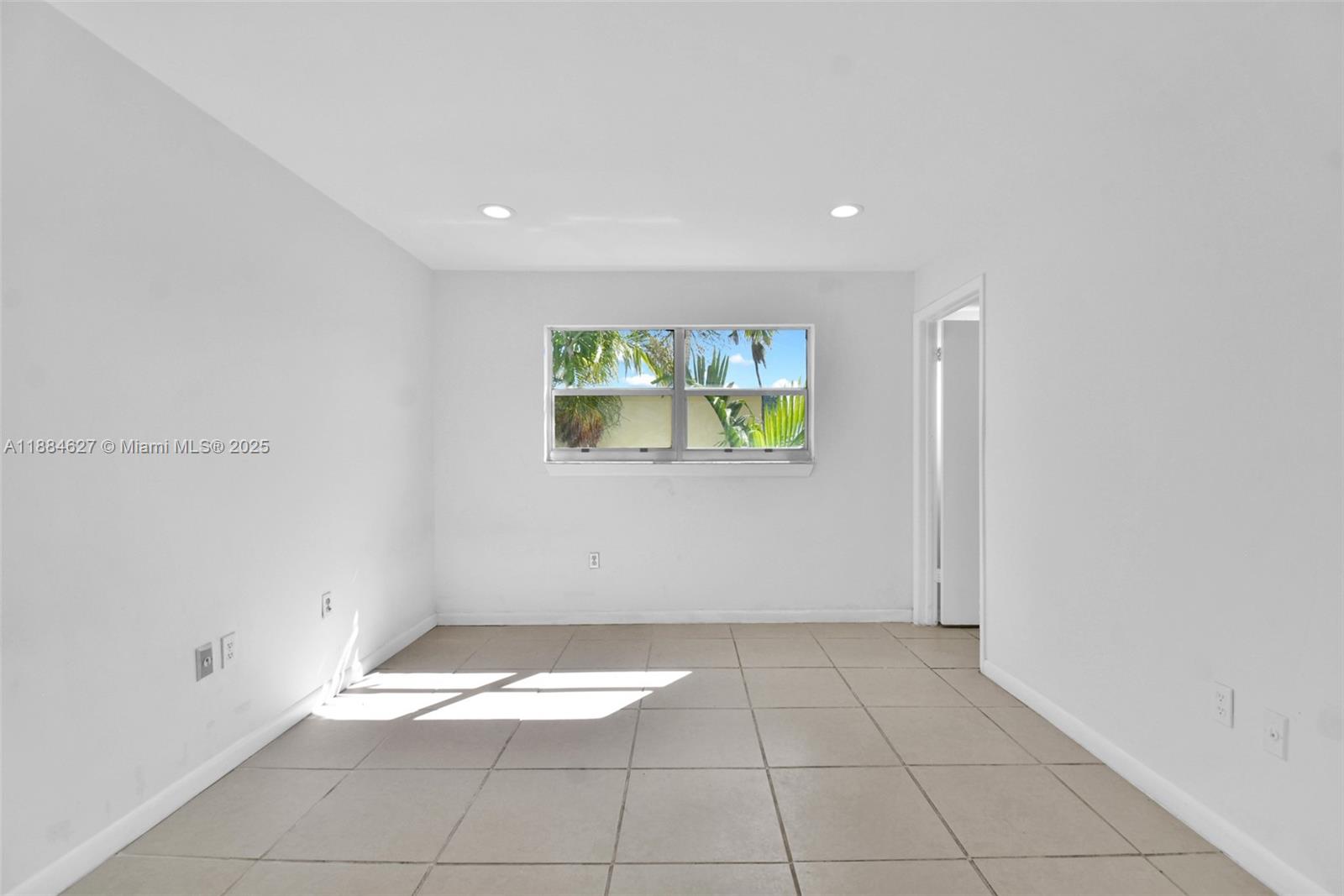 618 Euclid Avenue, Unit 303 Miami Beach, FL 33139 - Photo 10 of 26 a view of an empty room with a window