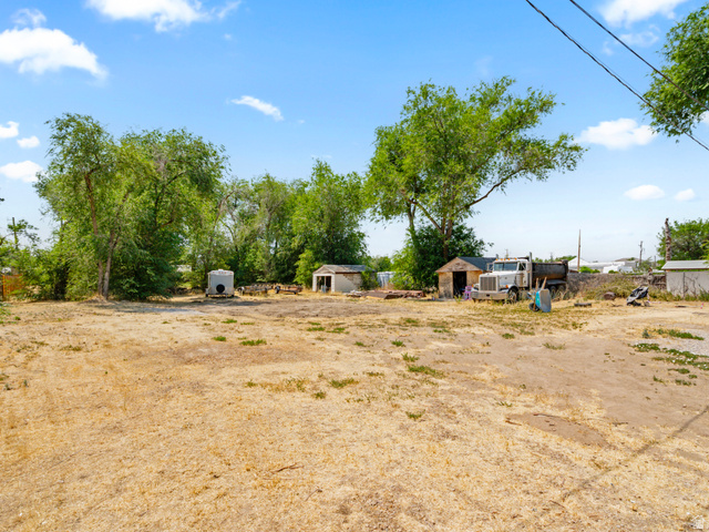 120 Cox Lane Midvale, UT 84047 - Photo 11 of 13 Expansive parcel featuring a large, unlandscaped area with established trees