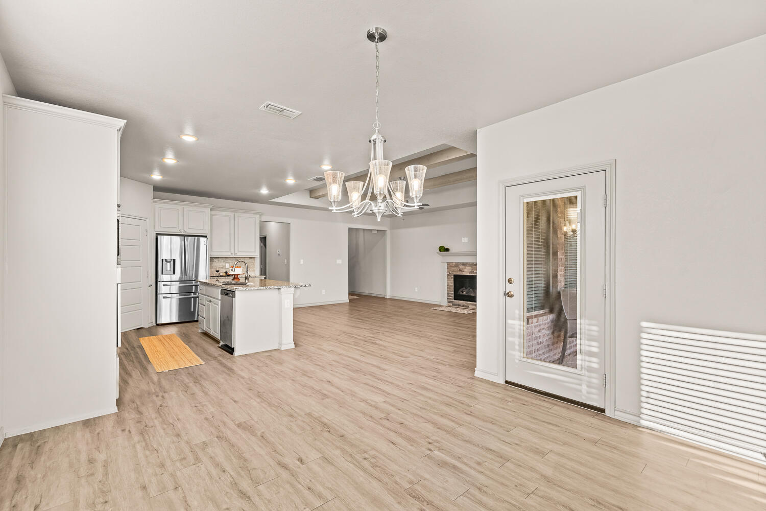 7613 61st Street Lubbock, TX 79407 - Photo 13 of 37 a view of kitchen with furniture and wooden floor