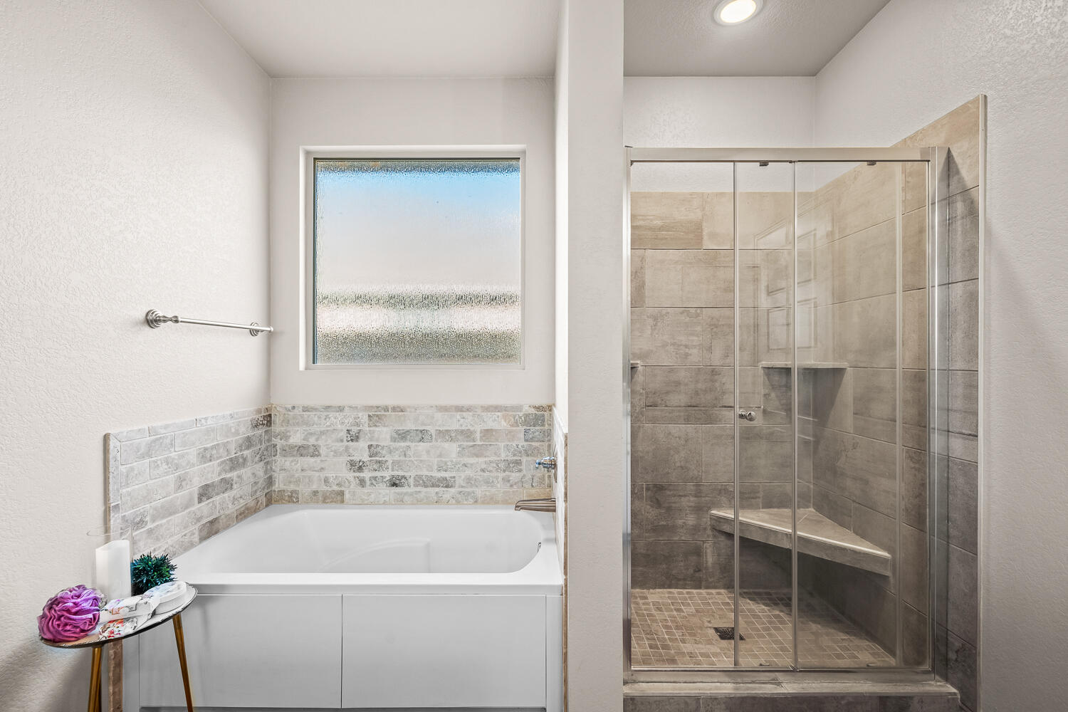 7613 61st Street Lubbock, TX 79407 - Photo 17 of 37 a bathroom with a tub and shower