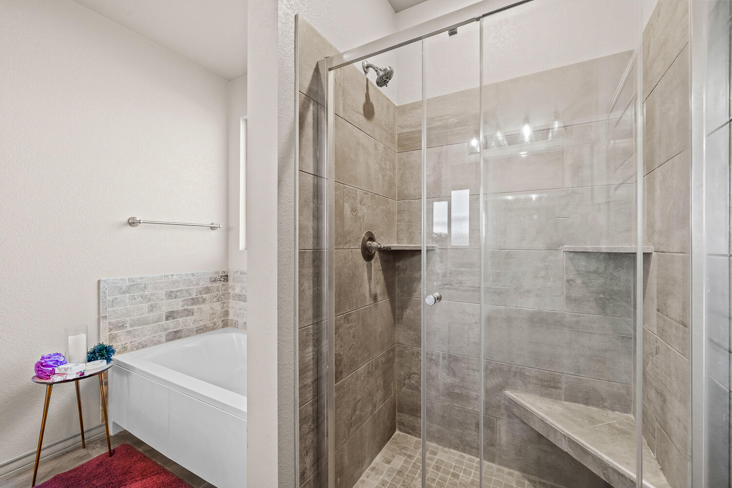 7613 61st Street Lubbock, TX 79407 - Photo 19 of 37 a bathroom with a shower and a bath tub