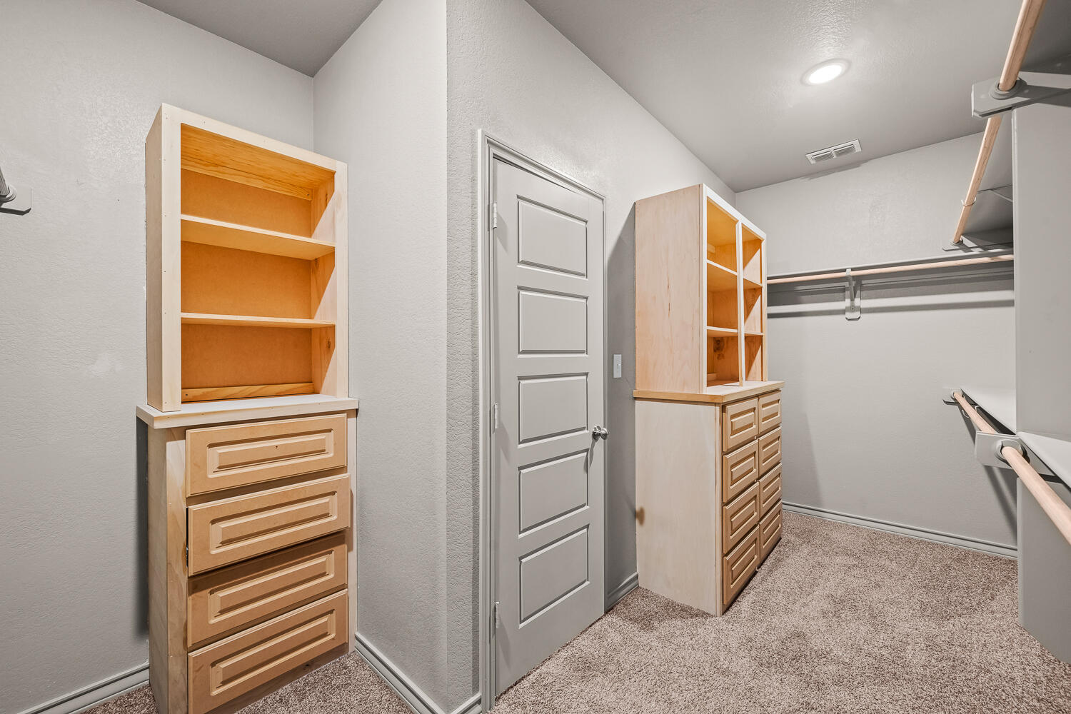 7613 61st Street Lubbock, TX 79407 - Photo 21 of 37 a view of walk in closet with empty racks