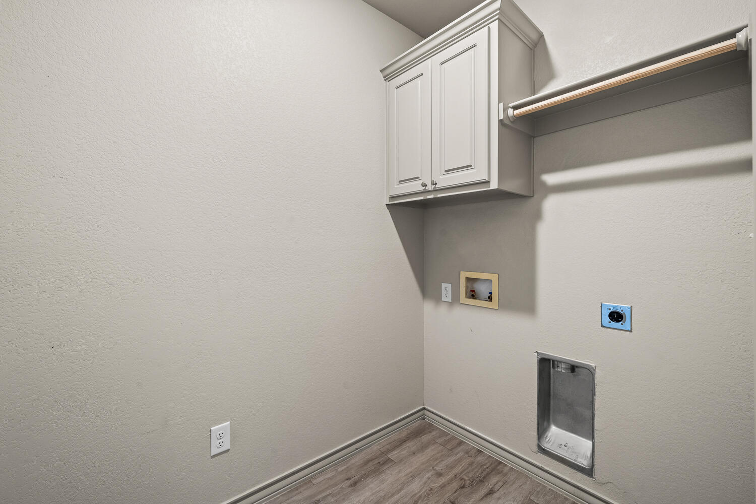7613 61st Street Lubbock, TX 79407 - Photo 33 of 37 a view of a storage and utility room with washer and dryer