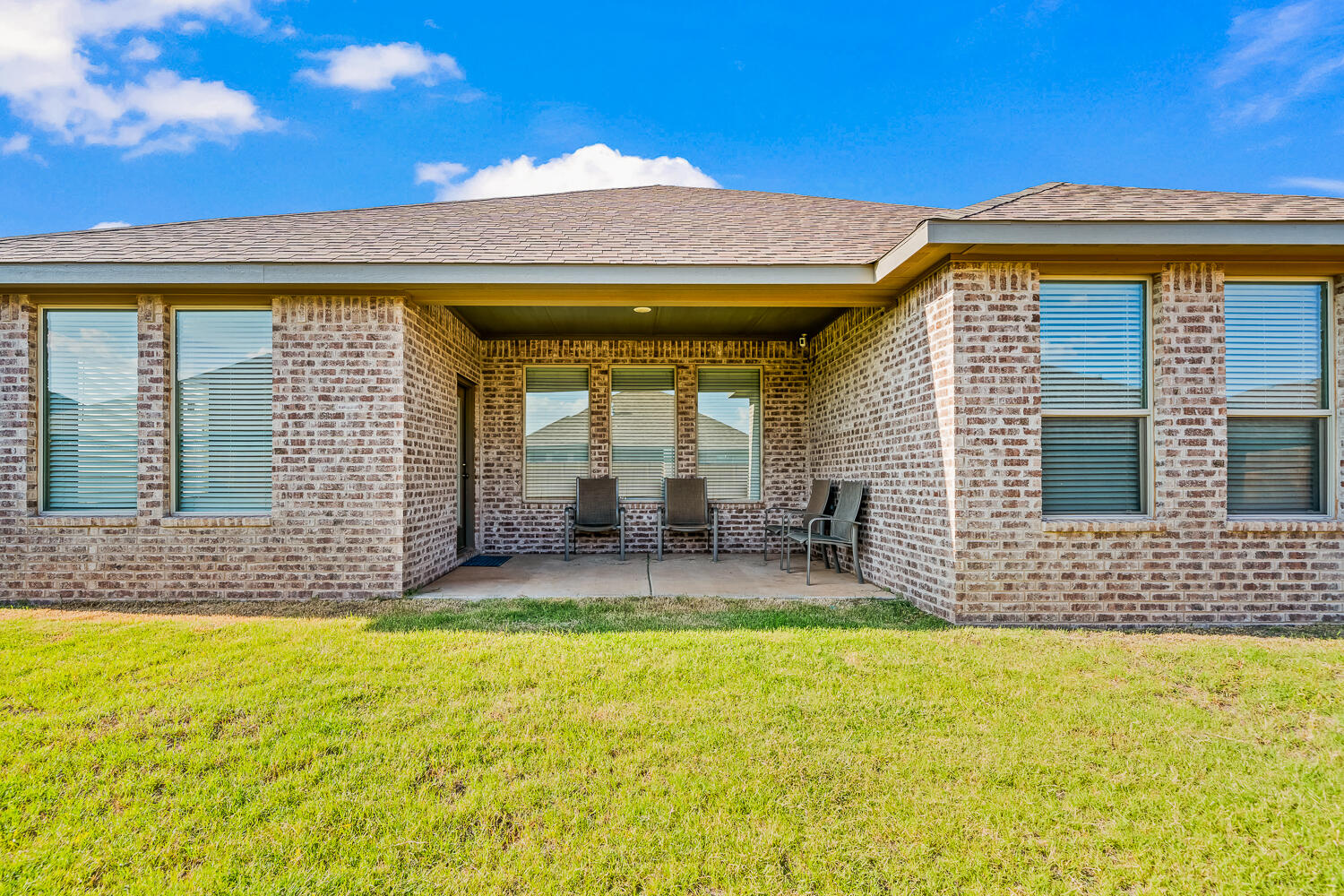 7613 61st Street Lubbock, TX 79407 - Photo 35 of 37 a front view of a house with a yard