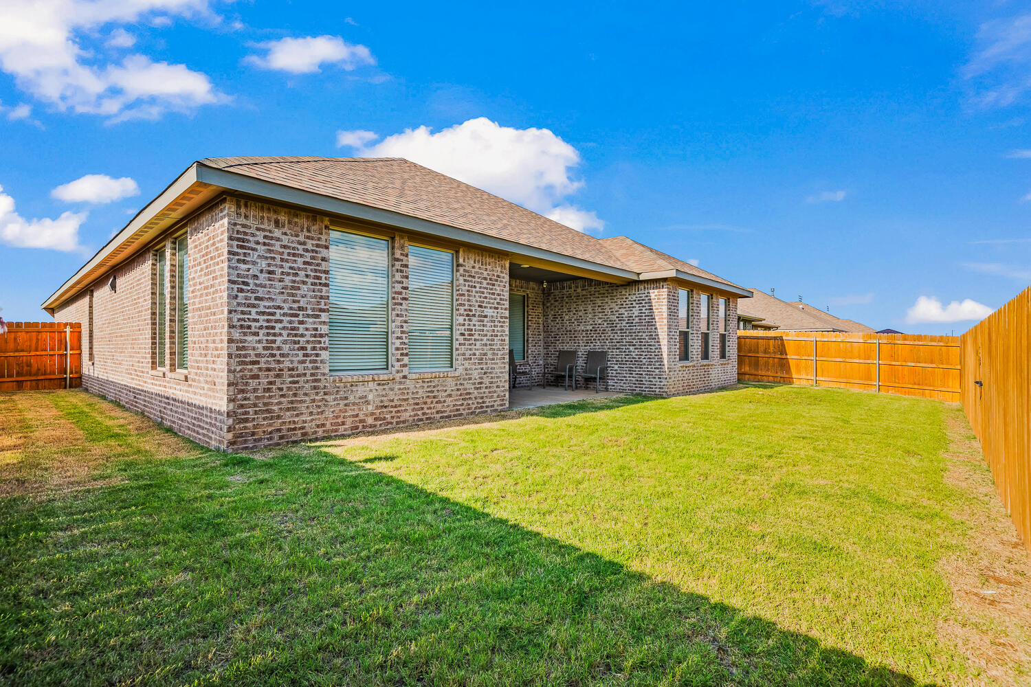 7613 61st Street Lubbock, TX 79407 - Photo 36 of 37 a front view of a house with a yard