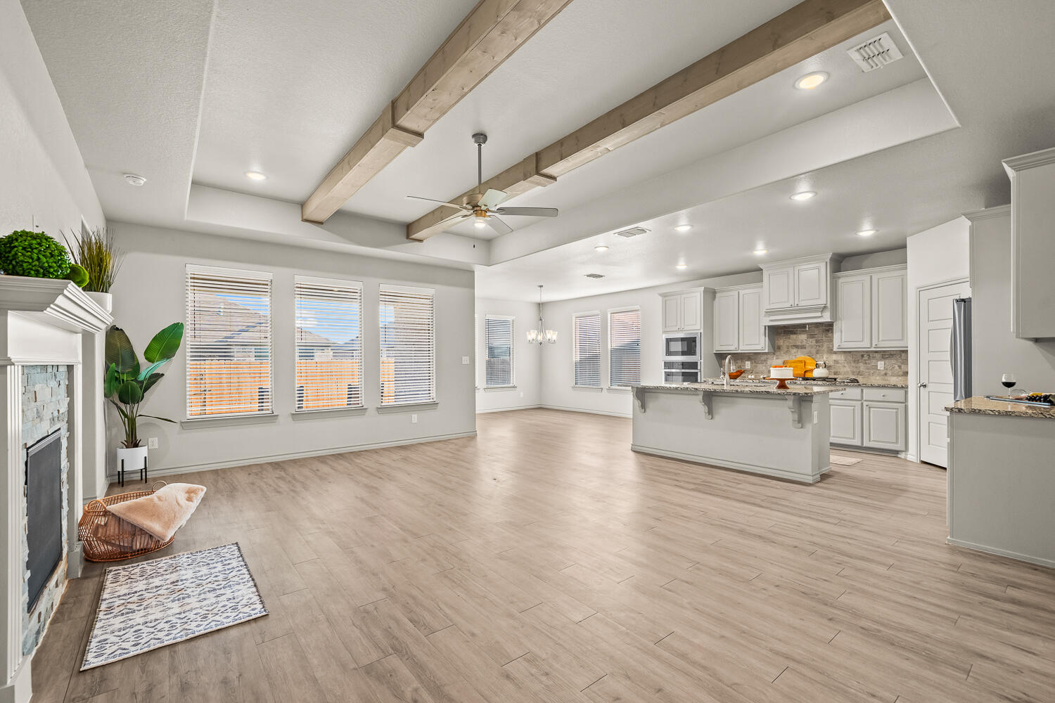 7613 61st Street Lubbock, TX 79407 - Photo 5 of 37 a view of kitchen with cabinets and wooden floor