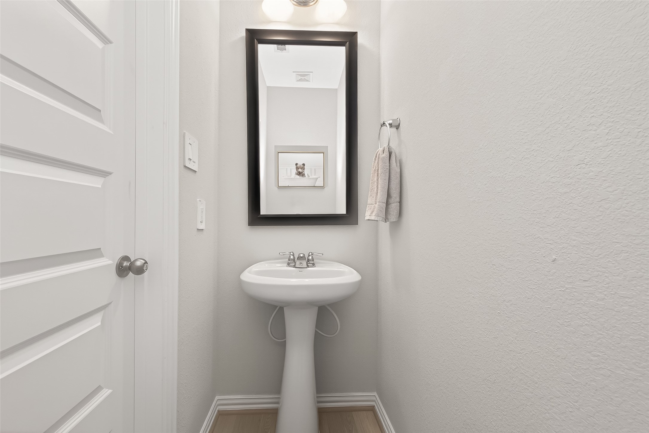 218 Skybranch Court Conroe, TX 77304 - Photo 19 of 50 a bathroom with a sink a mirror and shower