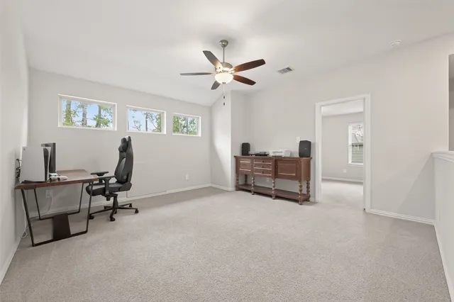 a living room with furniture and window