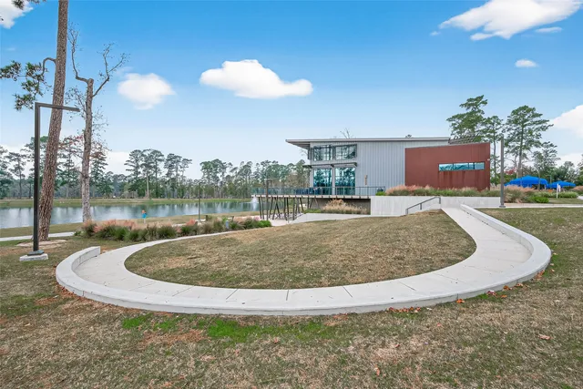 a view of a swimming pool with a yard