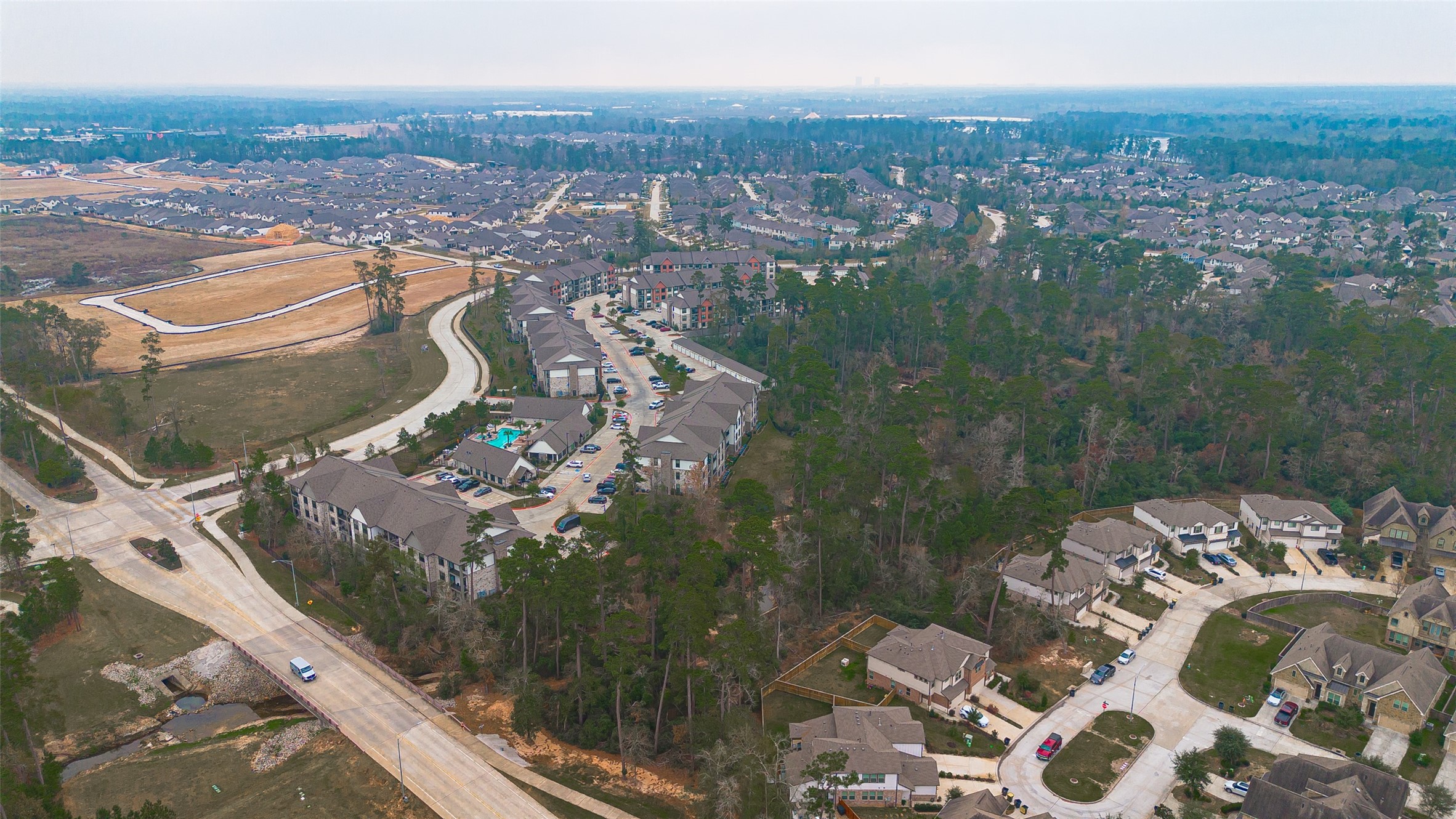 218 Skybranch Court Conroe, TX 77304 - Photo 50 of 50 a view of a city from a terrace