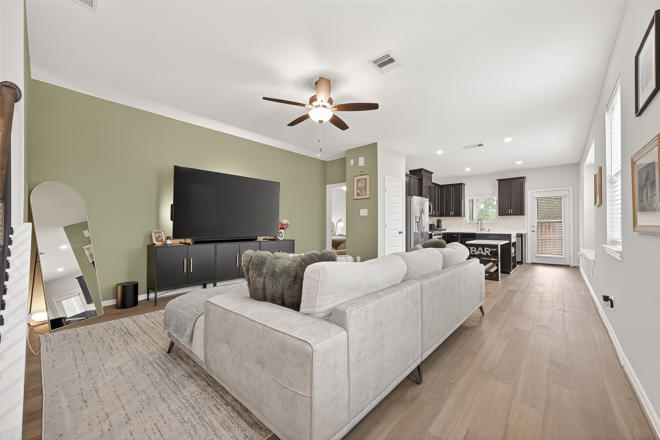 218 Skybranch Court Conroe, TX 77304 - Photo 8 of 50 a living room with furniture and a flat screen tv