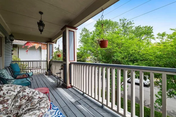 a view of balcony with wooden floor