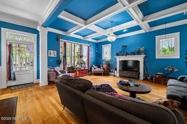 a bedroom with furniture and a flat screen tv