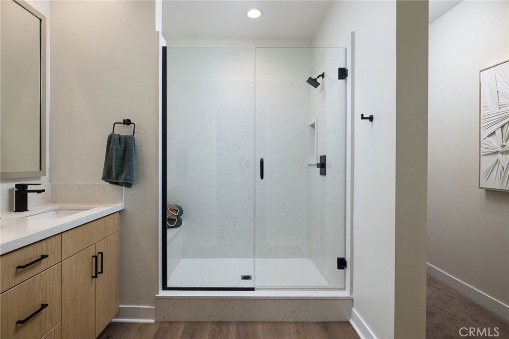 102 South Orchid El Cajon, CA 92019 - Photo 11 of 22 a bathroom with a shower a mirror and a sink