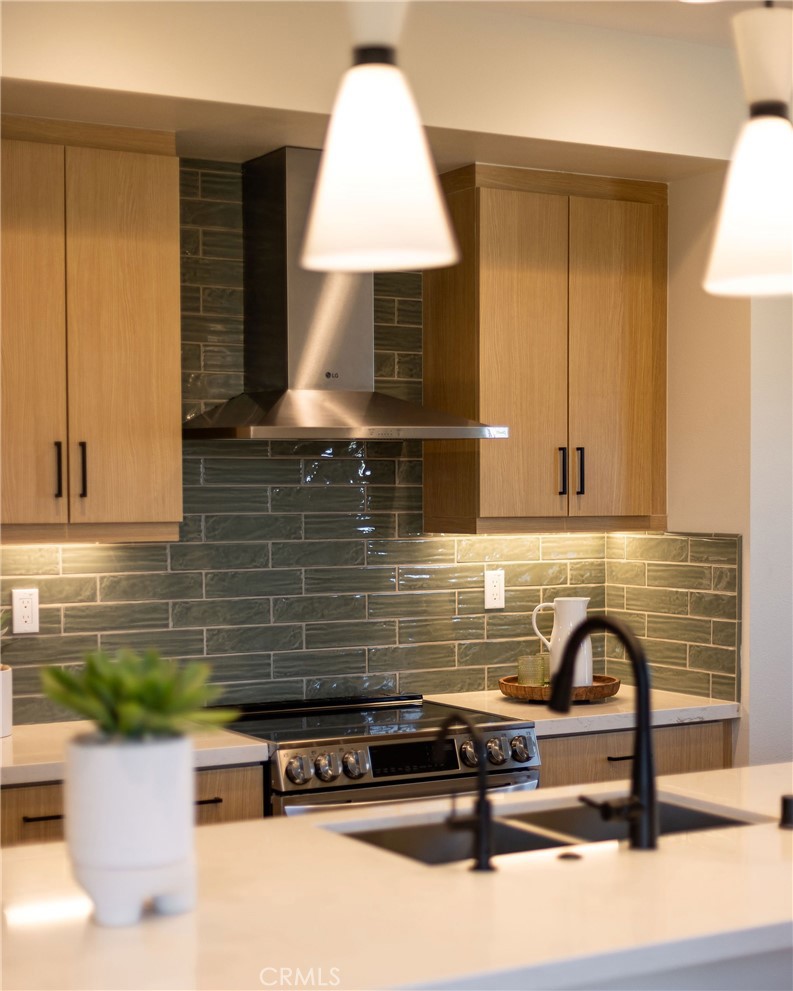 102 South Orchid El Cajon, CA 92019 - Photo 16 of 22 a kitchen with a sink and a stove