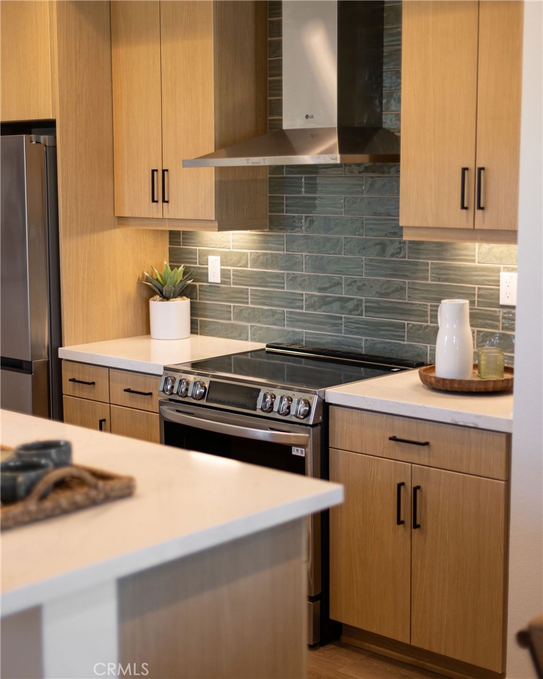 102 South Orchid El Cajon, CA 92019 - Photo 18 of 22 a kitchen with a stove cabinets and wooden floor