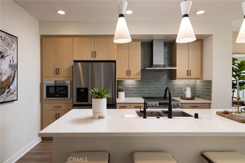 102 South Orchid El Cajon, CA 92019 - Photo 2 of 22 a kitchen with a sink a kitchen island and stainless steel appliances