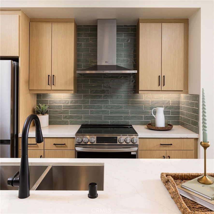 102 South Orchid El Cajon, CA 92019 - Photo 3 of 22 a kitchen with a sink a stove and cabinets