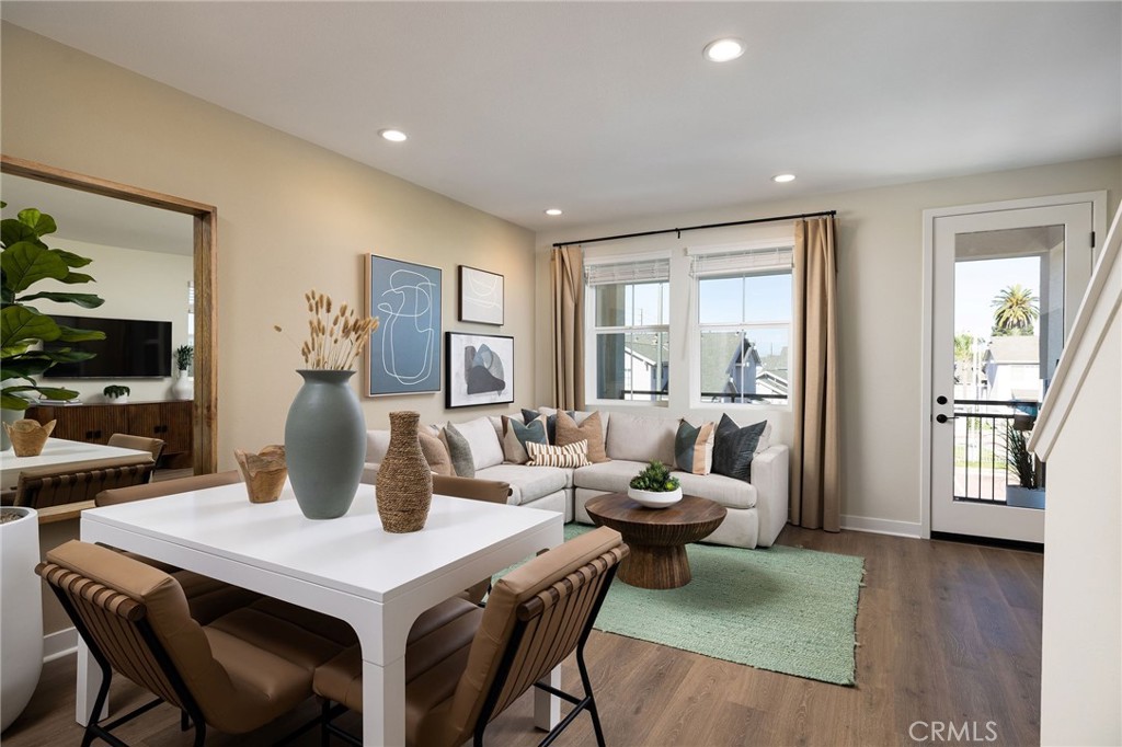 102 South Orchid El Cajon, CA 92019 - Photo 6 of 22 a living room with a table chairs and wooden floor
