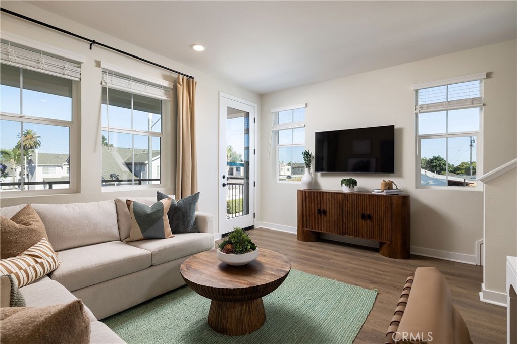 102 South Orchid El Cajon, CA 92019 - Photo 7 of 22 a living room with furniture a flat screen tv and a window