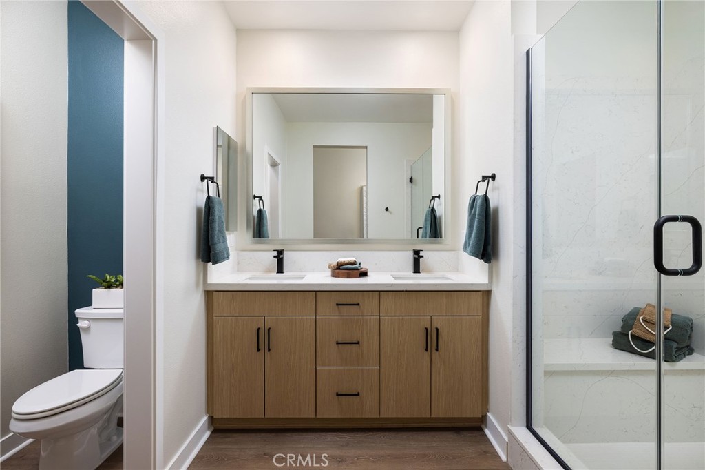 102 South Orchid El Cajon, CA 92019 - Photo 10 of 22 a bathroom with a sink a toilet and a mirror